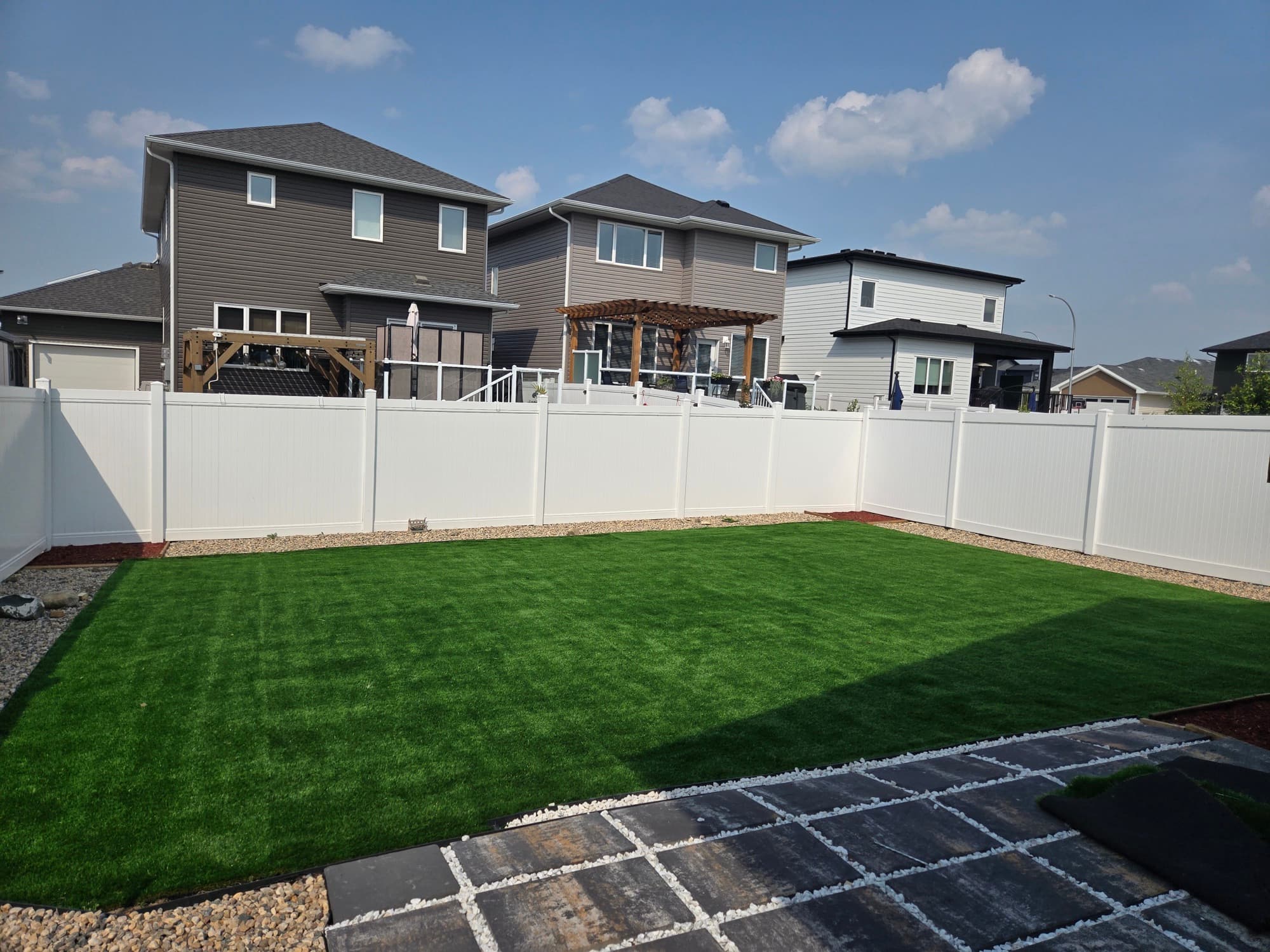 Backyard turf + vinyl fence — Warman, SK